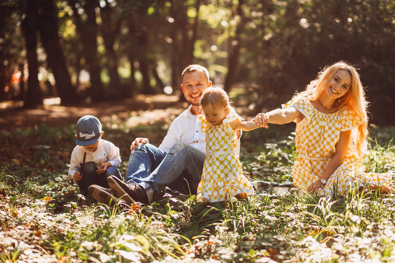 Family enjoying outdoor nature activities together on a sunny day
